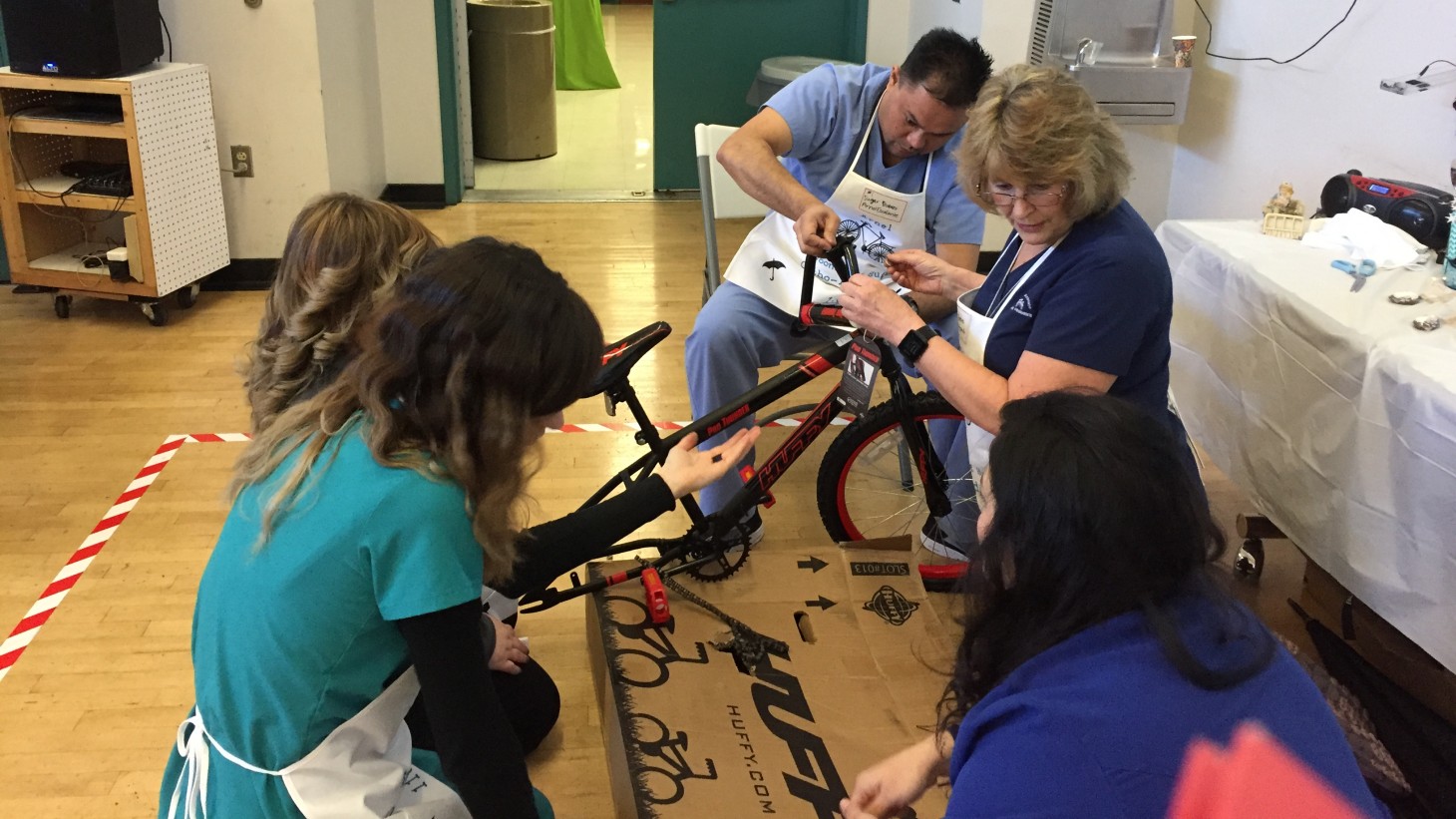 Workers build a bicycle