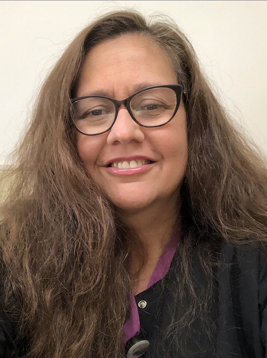 Portrait of woman with long brown hair 