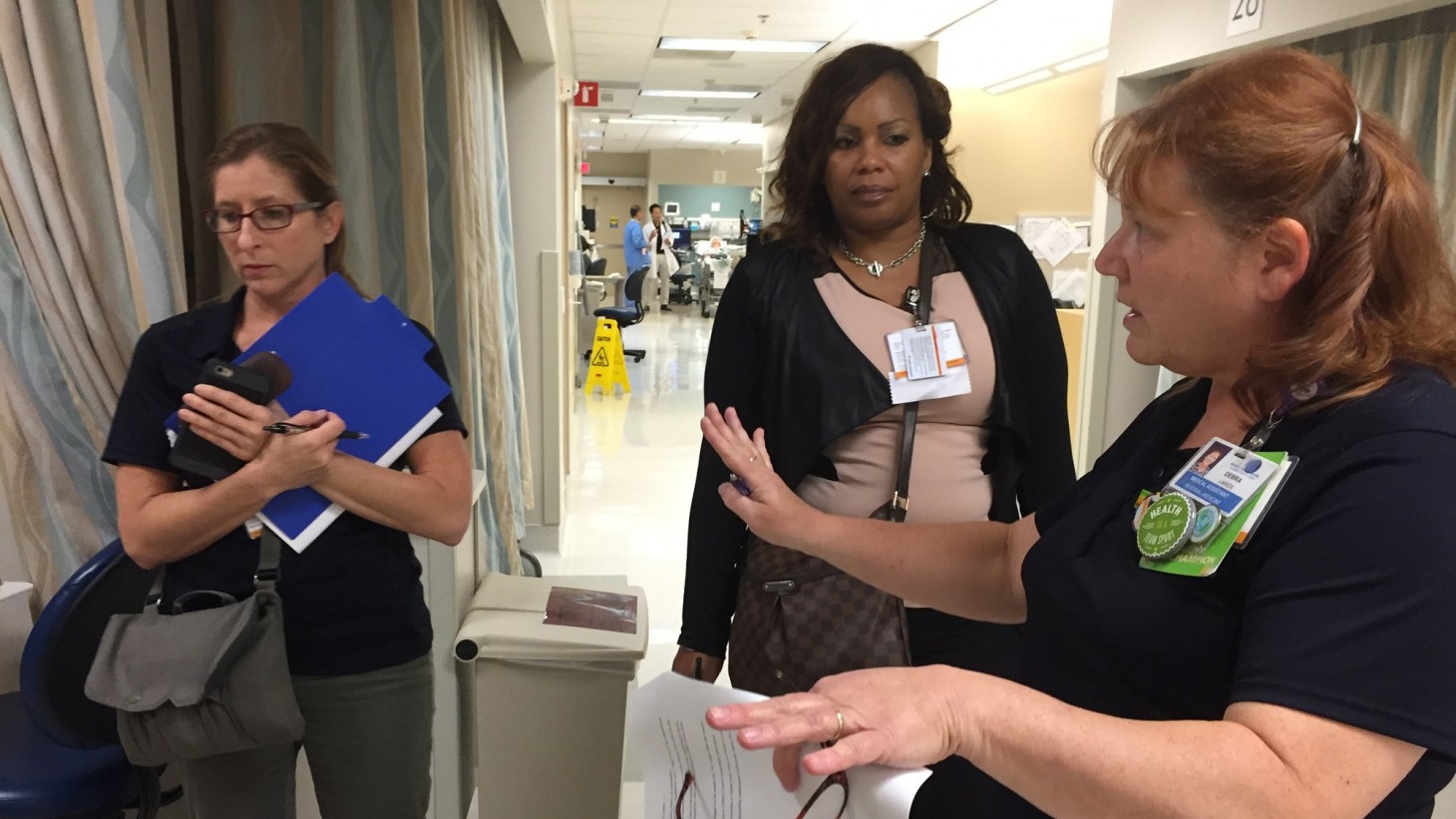 Debra Larios, right, discusses storage challenges with two fellow Tiger Team members