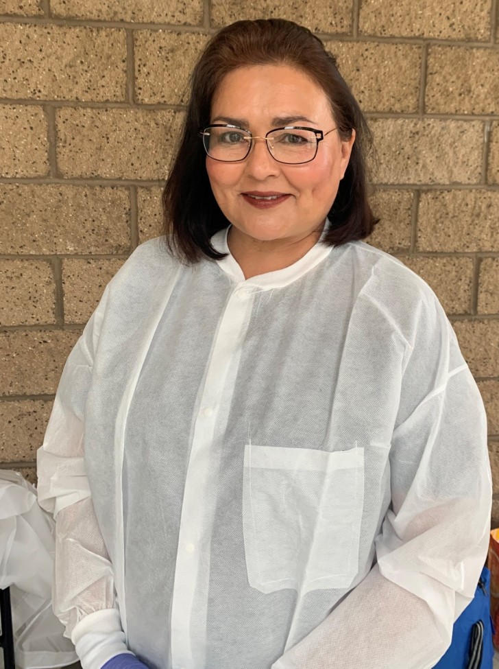 woman wearing white protective gear